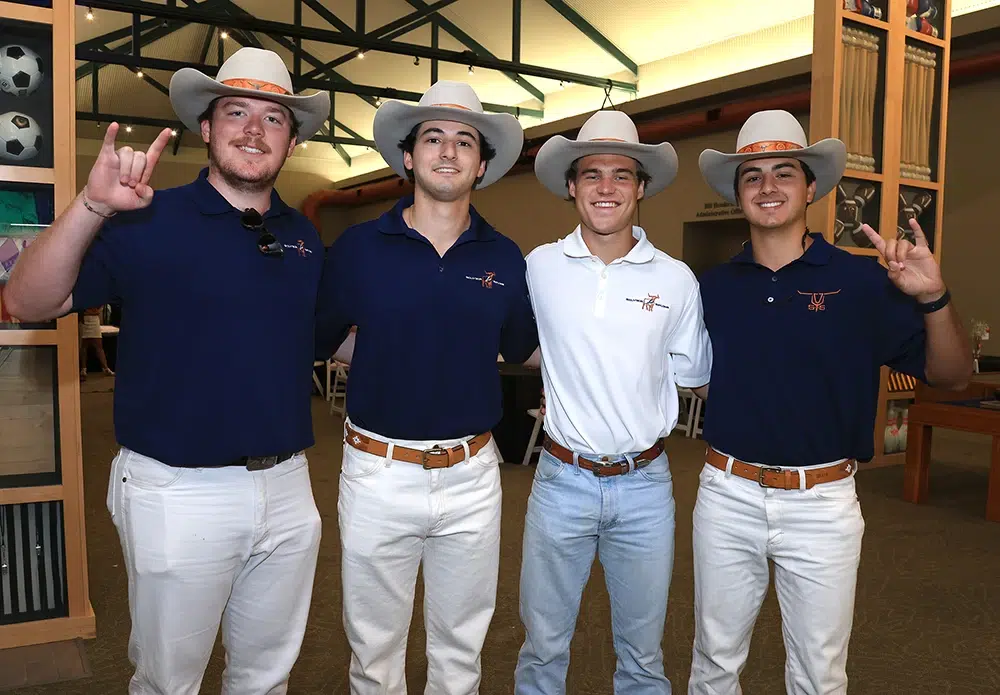 boys wearing cowboy hats